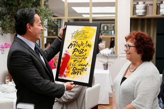 Michael Felix, chair of the board of councilors for the USC School of Dramatic Arts, celebrates Madeline Puzo’s 13 years of leadership as dean of the School by announcing the scholarship was named in her honor. Photo by Ryan Miller/Capture Imaging.