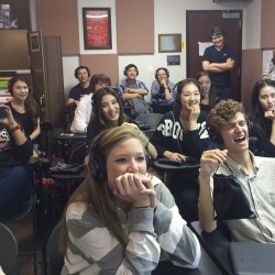 Image of students sharing a laugh during a voice-over demonstration.