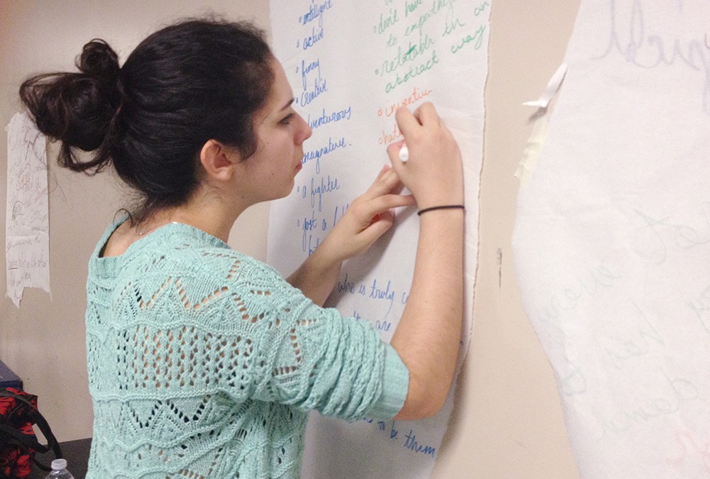 Student takes notes during Creating Character summer class.