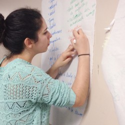 Student takes notes during Creating Character summer class.