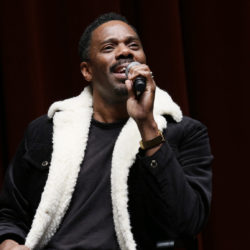 Actor Colman Domingo speaks into a microphone