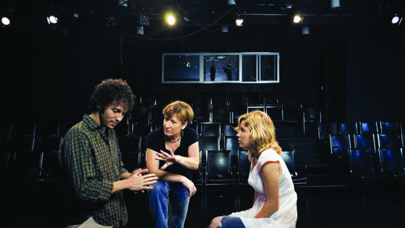 Photograph of Charlotte Cornwell coaching students in the Massman Theatre.