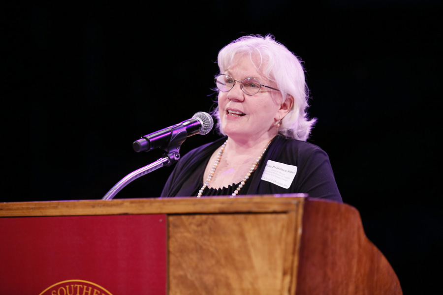 Tina Haatainen-Jones speaking at podium