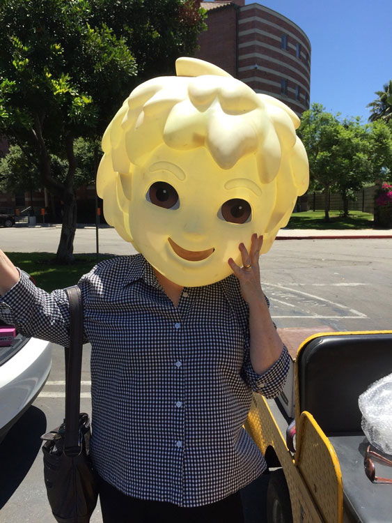 Tina Haatainen-Jones wearing a costume head on campus