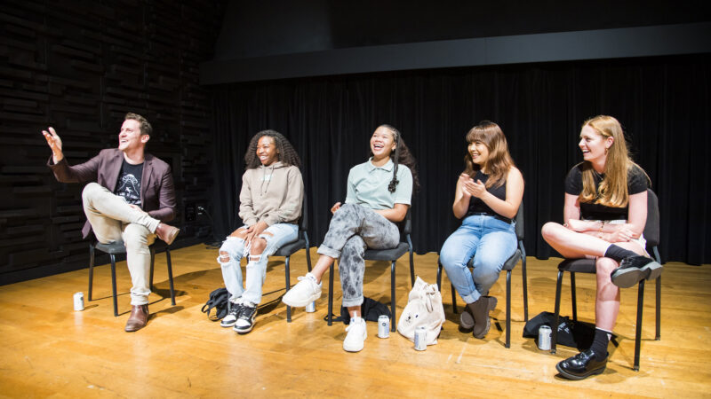 Michael Schwartz, Princess Isis Lang, Storm Reid, Amanda Angeles, and Clare Foley sitting on a stage