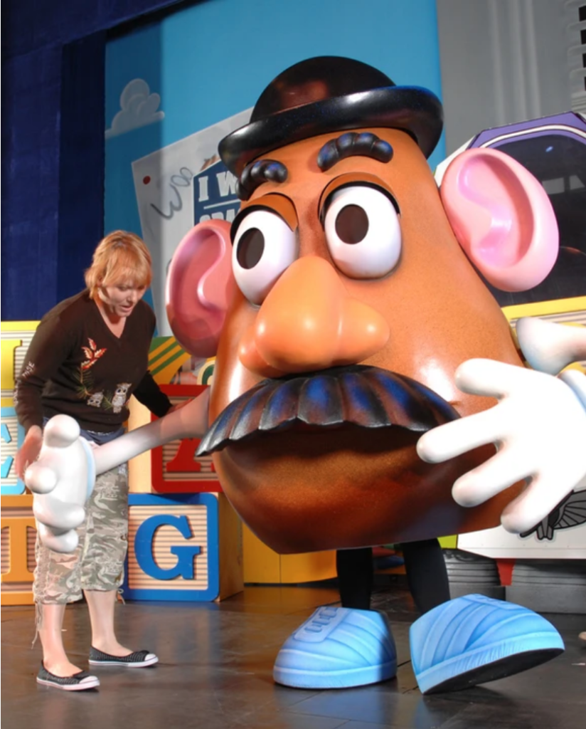 Ann Closs-Farley makes adjustments to Mr. Potato Head in Toy Story: The Musical