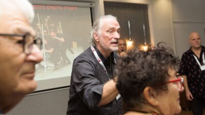 Brent Blair gestures to a group of workshop attendees in Israel.