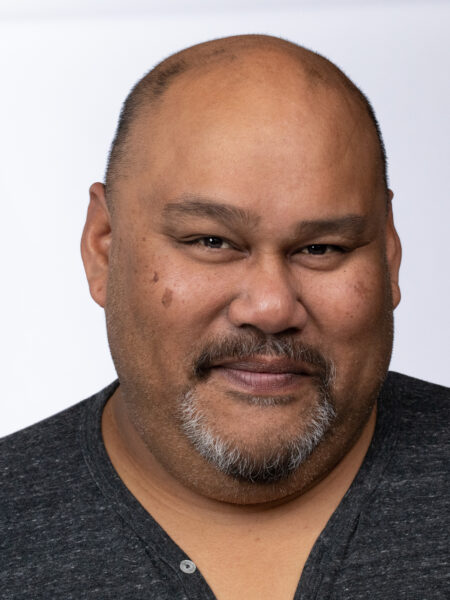 Headshot of Boni B. Alvarez smiling warmly at the camera.