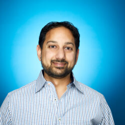 Headshot of Pranav Shah with blue background