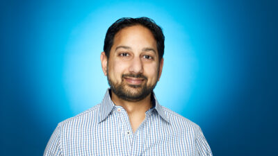 Headshot of Pranav Shah with blue background