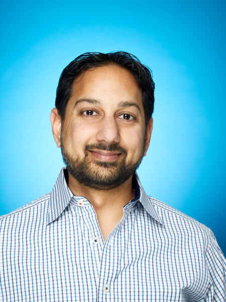 Headshot of Pranav Shah with blue background