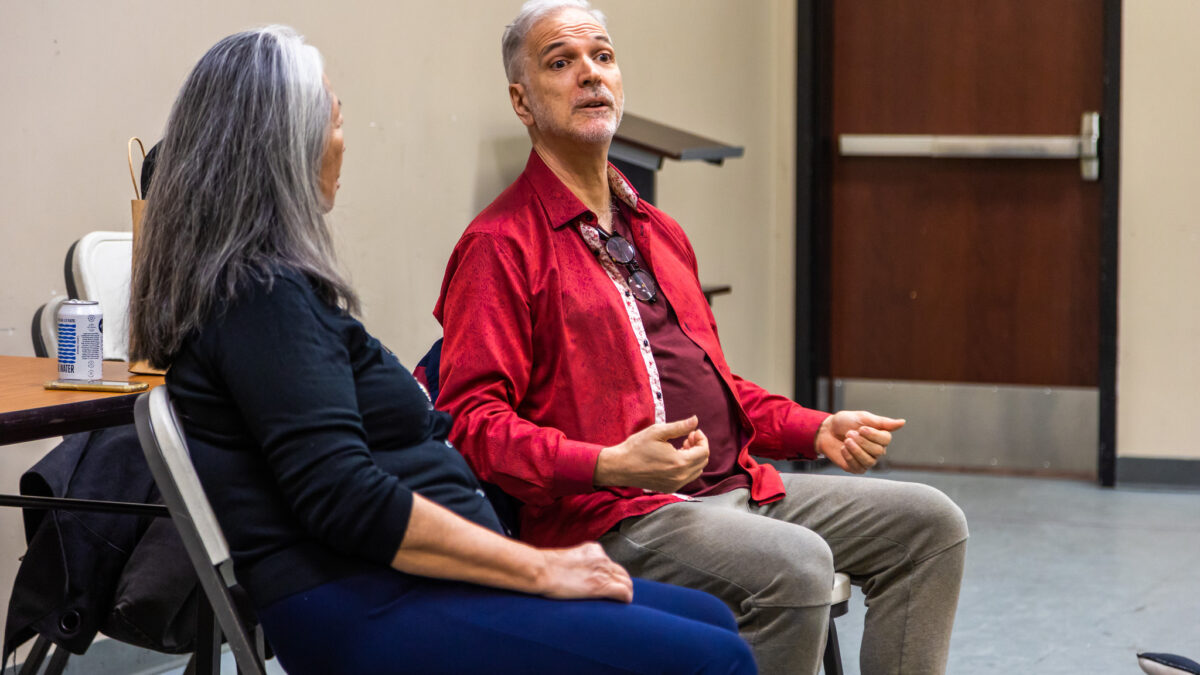 Professor Natsuko Ohama and voice coach Louis Colaianni sit in chairs in disucssion.