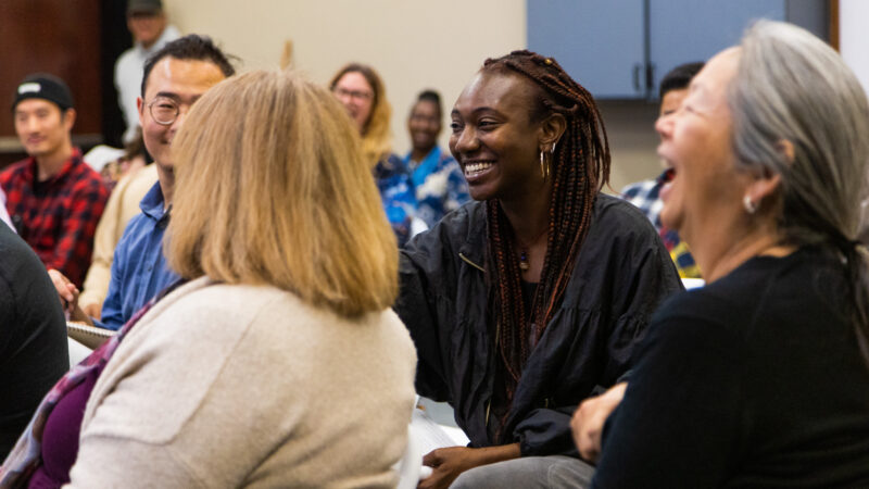 Image of people smiling and laughing