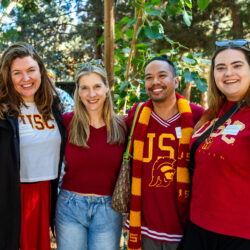 Photo of alumni celebrating at the USC SDA tailgate.