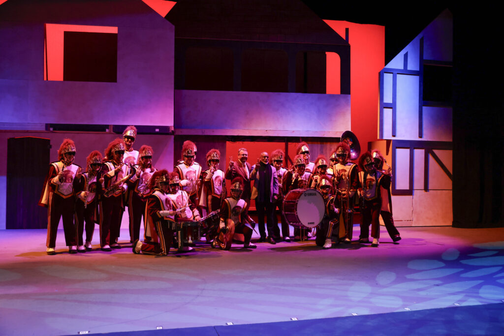 LeVar Burton poses with the Trojan Marching Band.