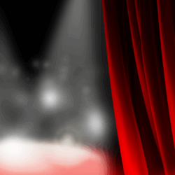 Stage lights on a blurry stage with red curtains opening