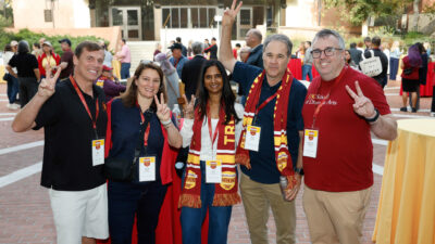 Image of parents smiling at an event during Trojan Family Weekend.
